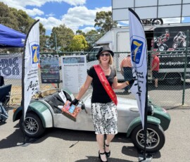 Michelle at the Historic Winton stand showing off her Fashion Awards Sash