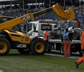 Loading Stenshorne's Formula 2 car on the tilt-tray after contact with his team mate on the entry to Turn 1