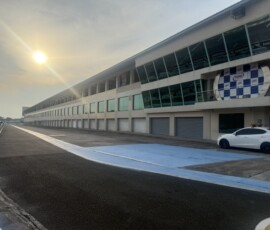 The view down pit lane with race control above the podium area